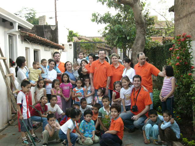 The children with some of the couples that volunteer for the project